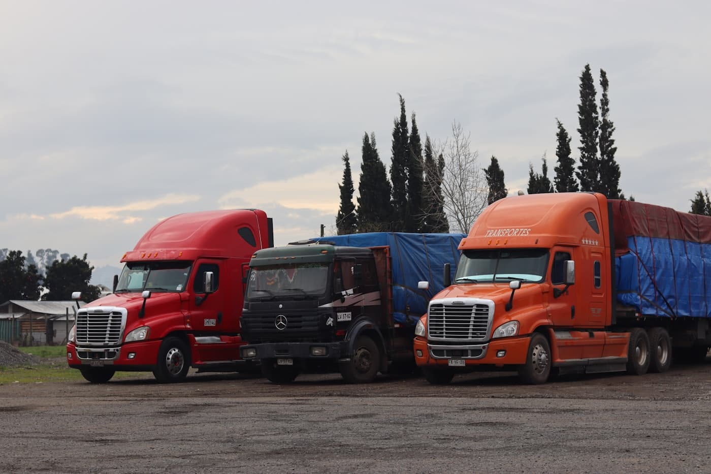 Fleet of semi trucks parked in a lot